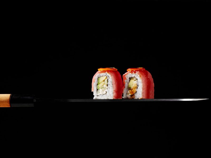 uramaki-rolls-with-tuna-cream-cheese-avocado-kumquat-slices-blade-japanese-sashimi-knife